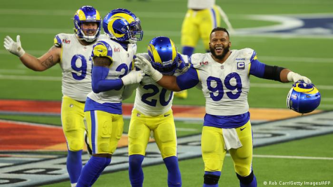 Aaron Donald and other Rams players celebrating after sealing a Super Bowl victory.