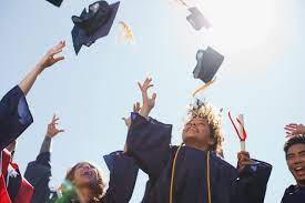 The Class of 2022 throws their graduation caps into the air. 