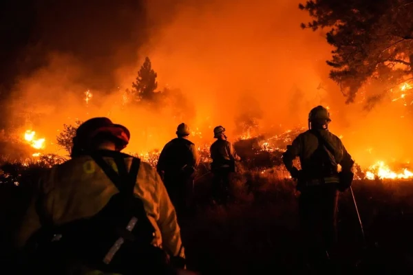 Firefighters battle the infernos from the air as ground crews create breaks in the vegetation in order to halt the blaze’s speedy advance