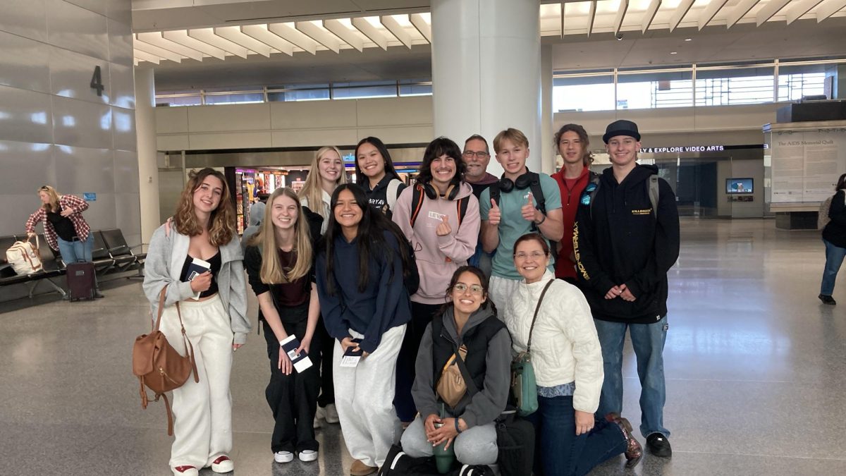 Australia/New Zealand students with their chaperone at the airport