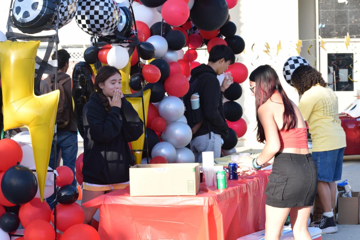 Popcorn and soda beverages being provided.