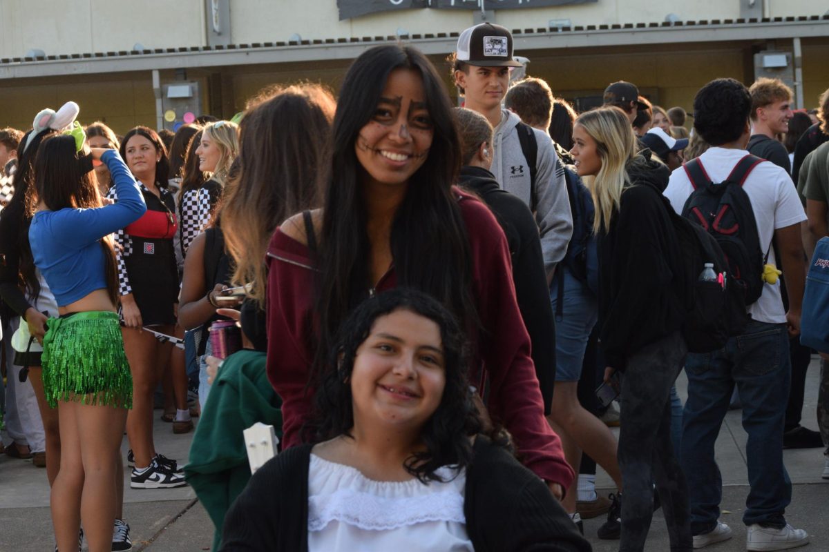 Senior students dressed up as Miguel and Mama Coco.